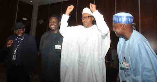 FILE PHOTO: President Buhari, flanked by Femi Adeshina and Garba Shehu: salutes the State House Press corps