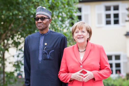 President Muhammdu and German Chancellor Angela Merkel pose for the cameras
