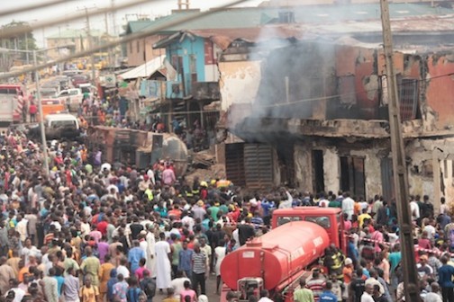 FILE PHOTO: Fire Service operatives, residents at the scene of the fire disaster in Idimu, Lagos