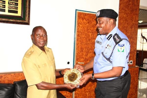 Inspector General of Police, Solomon Arase and Governor Adams Oshiomhole of Edo State