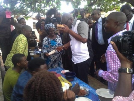 Governor Ayodele Fayose drinks some palm wine with his people