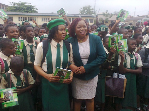 Okei-Odumakin (left) with the Principal of the school, Mrs Adebola Kolawole with students at school assembly