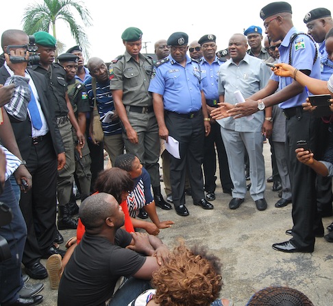 Rivers State Commissioner of Police, Mr Chris Ezike showing Governor Nyesom Wike, others recovered ammunitions