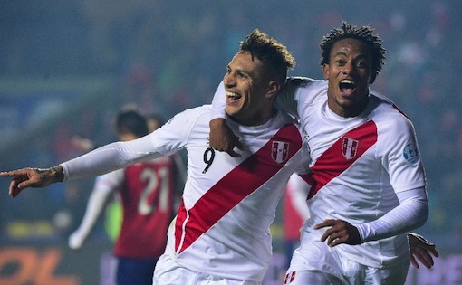 Peru’s Paolo Guerrero (L) celebrates with teammate Andre Carrillo after scoring a goal against Paraguay, during their Copa America 3rd place match, in Concepcion, Chile, on July 3, 2015 (AFP Photo/Luis Acosta)
