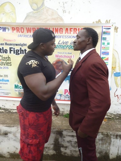 Power Lee (right) with a wrestler at the National Stadium,    Lagos