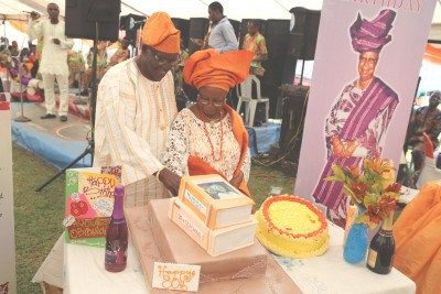 Celebrant... Chief Ayotunde Oyeyemi Osibamowo cutting her birthday cake assisted by her husband Engr. Olatunji