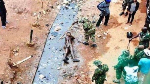 FILE PHOTO: Soldiers torturing an alleged armed robber