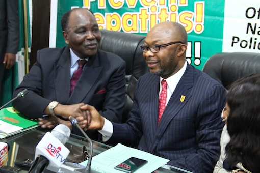 (L to R) Former Head of State, H.E. General  (Dr.) Yakubu Gowon, GCFR in a warm handshake with Permanent  Secretary,  Federal  Ministry of Health, (FMOH) Mr. Linus Awute during the  Press Briefing and official launch of the National Policy on Viral Hepatitis, which were part of activities commemorating the 2015 World Hepatitis Day