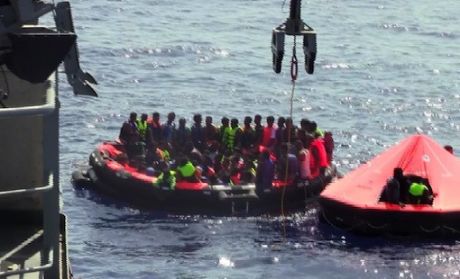 A video grab from handout footage released by the Irish Defence Forces and recorded aboard Irish Naval Service patrol vessel Le Niamh (L) on August 5, 2015 shows people in life rafts launched from Le Niamh during a rescue operation (AFP Photo/)