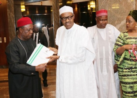 FILE PHOTO: President Buhari receives  RMAFC report on cost of governance, from Chairman, Elias Mbam