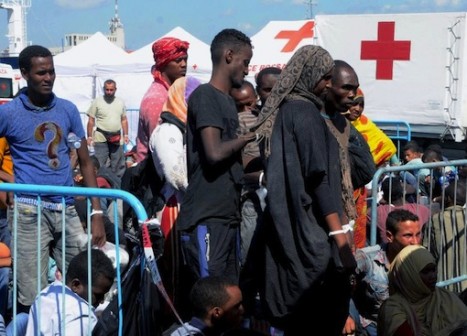 African Migrants wait in Catania harbour after being rescued by the Italian coast guard on August 26, 2015 while as 50 bodies were found in the hold of a boat heading for Italy (AFP Photo/Dario Azzaro)