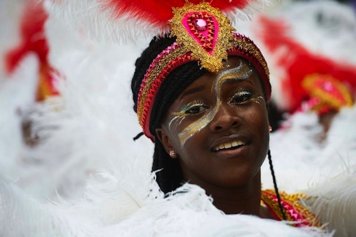 The Notting Hill Carnival, an annual two-day event, Europe's biggest street party, snakes through the streets on a five-kilometre parade route featuring steel bands and dancers in exotic carnival costumes, watched by crowds of revellers (AFP Photo/Nilas Halle'N)