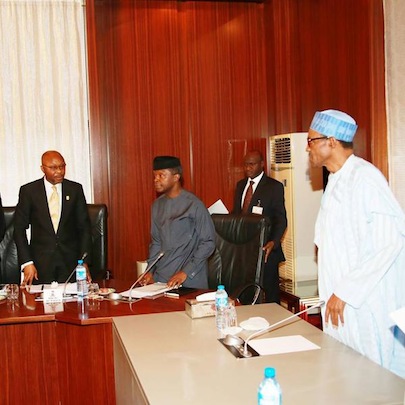 President Buhari (rightI VP Osibajo (middle) and Linus   Awute (left) during the briefing of the President by Federal Ministry of   Health