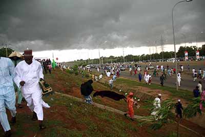 Muslims faithful running out of the National prayer ground along airport road Abuja (10)_edited