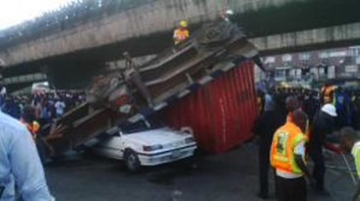 File photo showing scene of accident at Ojuelegba, Lagos, where a container fell off a truck and killed three persons