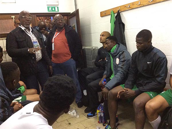 Amaju Pinnick (left standing) addressing the Super Eagles   players after their game against DR Congo on Thursday.(1)