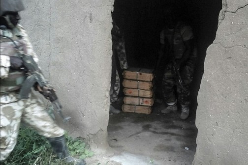 Picture provided by the Nigerian army on October 28, 2015 shows troops seizing a weapons cache around Boko Haram's Sambisa forest stronghold in the northeast