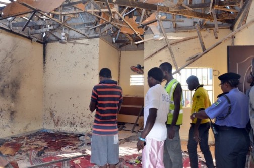 FILE PHOTO: People stand in a mosque in Maiduguri on 23 October following a suicide bombing Photo: AFP