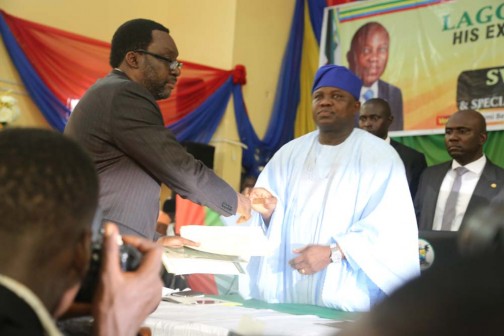 Gov. Akinmuni Amboder in a handshake with newly appointed Commissioner for Information and Strategy, Steve Ayorinde, after his swearing in on Monday in Lagos. Photos: Idowu Ogunleye.