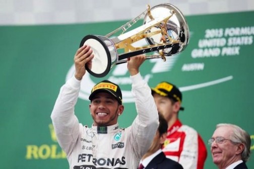 In Austin, Texas, Lewis Hamilton raises his third F1 world title to the admiration of the cheering crowd Photo: Reuters