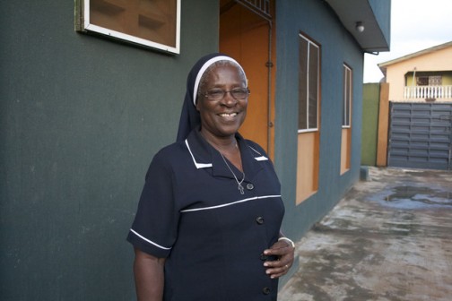 In this photo taken Saturday Aug. 22, 2015. Patricia Ebegbulem, a Catholic nun, stands outside the door of Bakhita Villa, a shelter she runs for trafficking survivors in Lagos, Nigeria. AP Photo/Caelainn Hogan)