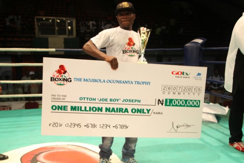 Otto 'Joe Boy' Joseph displays his N1m prize money after being adjudged the best boxer of the 4th GOtv Boxing Night at the National Stadium in Lagos on Sunday. PHOTO: Courtesy MultiChoice Nigeria. 