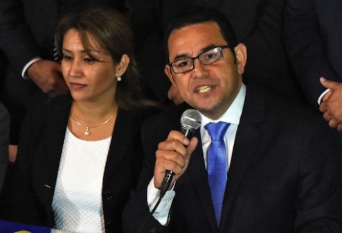 President-elect Jimmy Morales, of the National Front Convergence, delivers a speech next to his wife Hilda Marroquin, after winning the run-off election, in Guatemala City on October 25, 2015 (AFP Photo/Rodrigo Arangua)