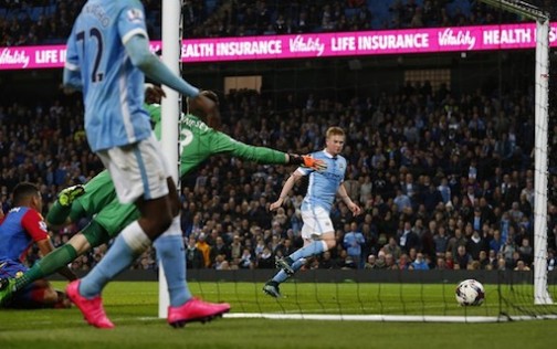 Kevin De Bruyne puts the ball past Crystal Palace goalkeeper