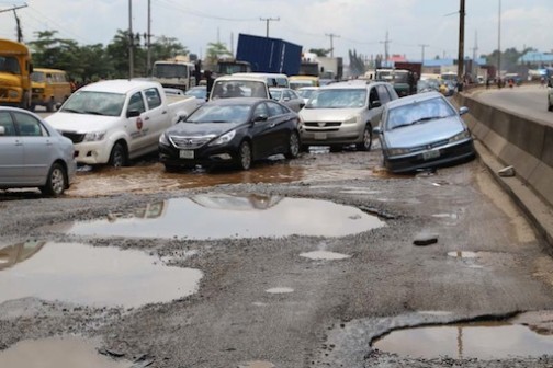 Vehicles struggle to use the only good patch on this road but even the supposed good path is not good. This is Ilasamaja road in Lagos State Photo: Idowu Ogunleye/PM News