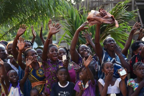 Thousands lined the streets of Bangui, capital of the strife-ridden Central African Republic, to welcome Pope Francis as he arrived November 29, 2015 as "a pilgrim of peace" bringing a message of hope and reconciliation (AFP Photo/Giuseppe Cacace)