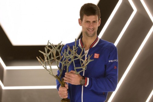 Serbia's Novak Djokovic poses with the trophy after winning the final match against Britain's Andy Murray at the ATP World Tour Masters 1000 indoor tournament in Paris, on November 8, 2015 (AFP Photo/Miguel Medina)