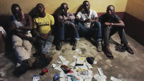 The suspects with the fake dollars recovered from them in Lagos