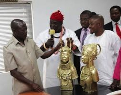 FILE PHOTO: Chief Luke Abbas, (M), presents souvenirs to Governor Adams Oshiomhole of Edo State during a courtesy visit of the Igbo Community Union to the Governor in his office on 12 June 2013.