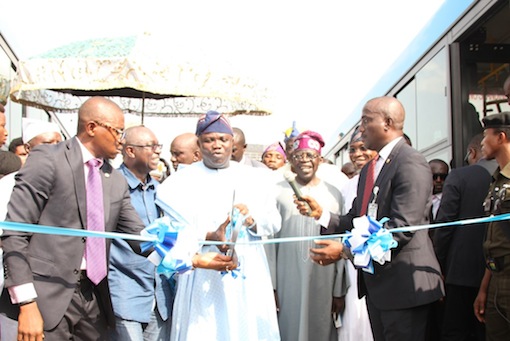 Lagos State Governor, Mr. Akinwunmi Ambode (2nd left), cutting the tape to commission the Mile 12-Ikorodu BRT Extension and launching of new Bus Rapid Transit, on Thursday, November 12, 2015. With him are Osun State Governor, Ogbeni Rauf Aregbesola (right); APC National Leader, Asiwaju Bola Tinubu (2nd right) and Commissioner for Transportation, Dr. Dayo Mobereola (left)