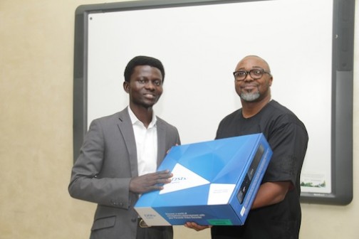 Femi Asu of The Punch presented with a DStv Explora by Multichoice MD, John Ugbe