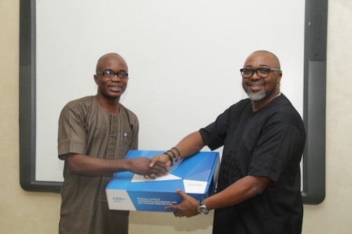 Adewale Emosu of Nigerian Tribune is presented a DStv Explora by Multichoice MD, John Ugbe