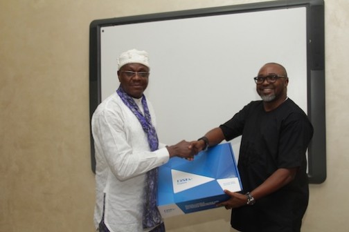Ibanga Isine of Premium Times receives a DStv Explora from Multichoice MD, John Ugbe 