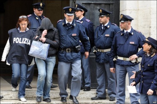 FILE PHOTO: Italian police escort a suspected mafia drug runner