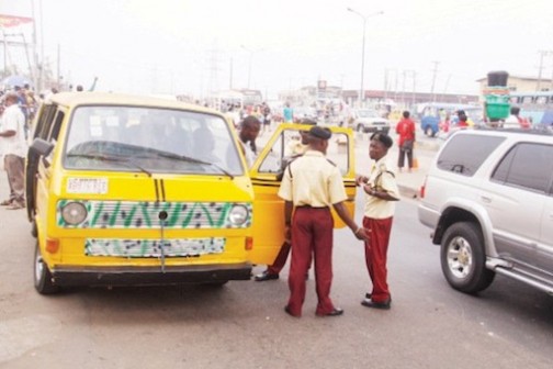 FILE PHOTO: LASTMA officials interrogating a commercial bus driver
