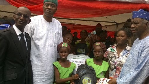 Pic Caption: •L-R: The immediate past chairman of Lagos Island East LCDA, Kamal Salau-Bashua, the council's Executive Secretary, Hon. Lookman Adisa Omotosho, presenting the educational materials to pupils of Anglican Girls Primary School and their headmistress, with them is an APC chieftain, Prince Tajudeen Olushi, recently