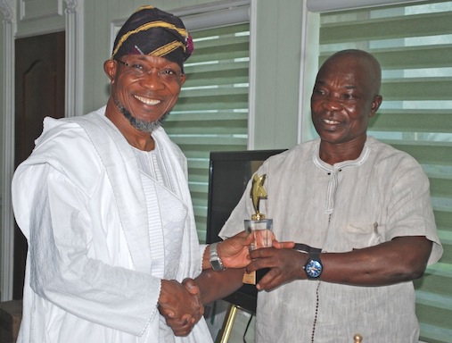 Governor State of Osun Ogbeni Rauf Aregbesola (left) Receiving the PANAFEST Award of Out Standing Leadership from Consulate General of Ghana in Lagos, Mr Kwabena Appiah, in his office at Government Secretariat, Abere, Osogbo at the wrekend