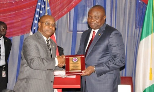 Lagos State Governor, Mr. Akinwunmi Ambode (right) being presented with a plaque by President, Humbert H. Humphrey Fellowship Alumni Association, Nigeria, Mr. Jude Ememe, during the 2015 Humbert H. Humphrey Annual Lecture and Awards Luncheon, at the Metropolitan Club, Kofo Abayomi Street, Victoria Island, Lagos, on Thursday, November 19, 2015.