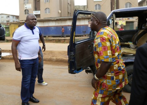 Lagos State Governor, Mr. Akinwunmi Ambode (left), arrests a commercial bus driver who was driving against traffic on Ejigbo road, during his inspection of the ongoing construction of Ejigbo road, on Sunday, November 08, 2015.