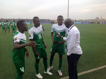 Siasia (right) dishes out instructions to three of his boys during the match against Mali