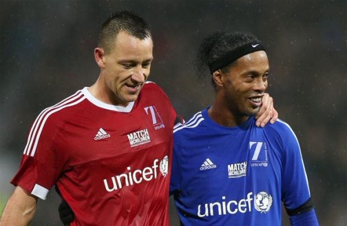 John Terry and Ronaldinho shares a joke during a charity match