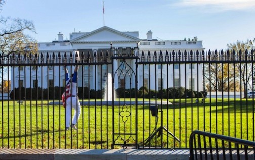 The man gestures after jumping into the White House