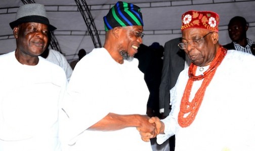 Governor State of Osun, Ogbeni Rauf Aregbesola, exchanging pleasantries with the  Owa Obokun Adimula of Ijesaland, Oba Gabriel Adekunle Aromolaran. With them is the former Inspector General of Police, Dr. Mike Mbama Okiro, during the 2015 Iwude Ijesa Festival at Owa's Palace on Saturday 26/12/2015