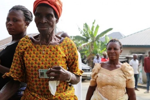 An elderly woman displaying her voters card at Sagbama Ward 6.  Photo: Idowu Ogunleye