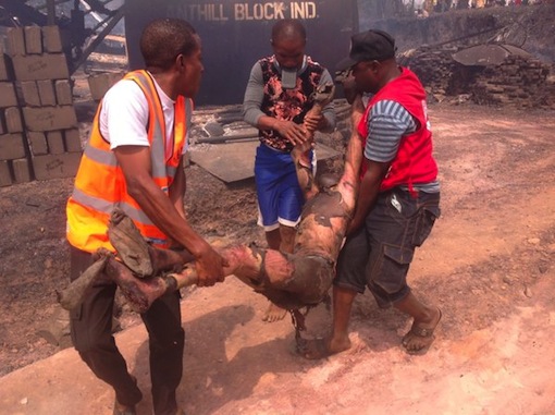 Anambra Gas Explosion Rescue team helps a victim of the Nnewi gas explosion