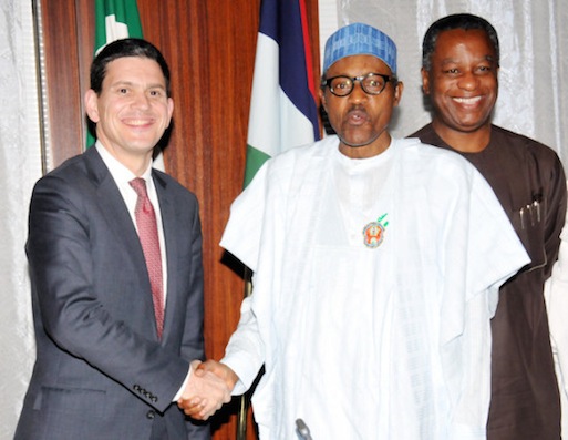 Buhari with David Milliband, president of International Rescue Committee. Beaming behind, is Foreign Minister, Geoffrey Onyema. Photo Sunday Aghaeze